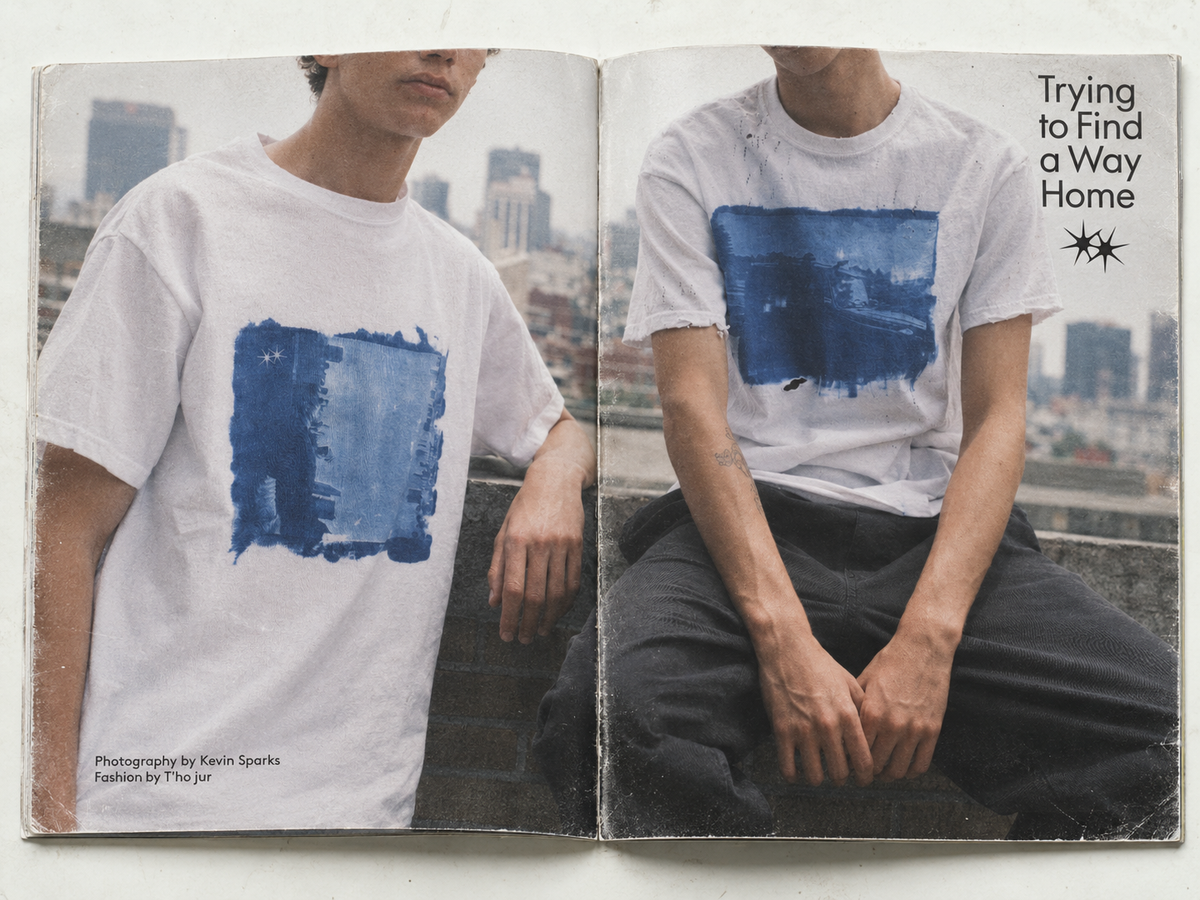 Open book showing blue T'ho jur prints in a rooftop fashion editorial